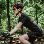 cycling in the woods with glasses on