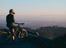 Biker Overlooking a Valley