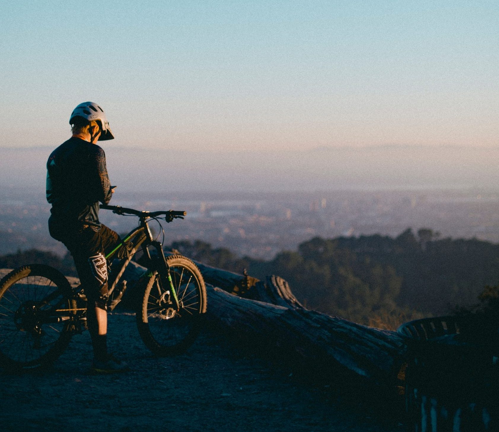 Biker Overlooking a Valley