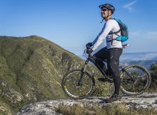 person on a mountain bike with a helmet on
