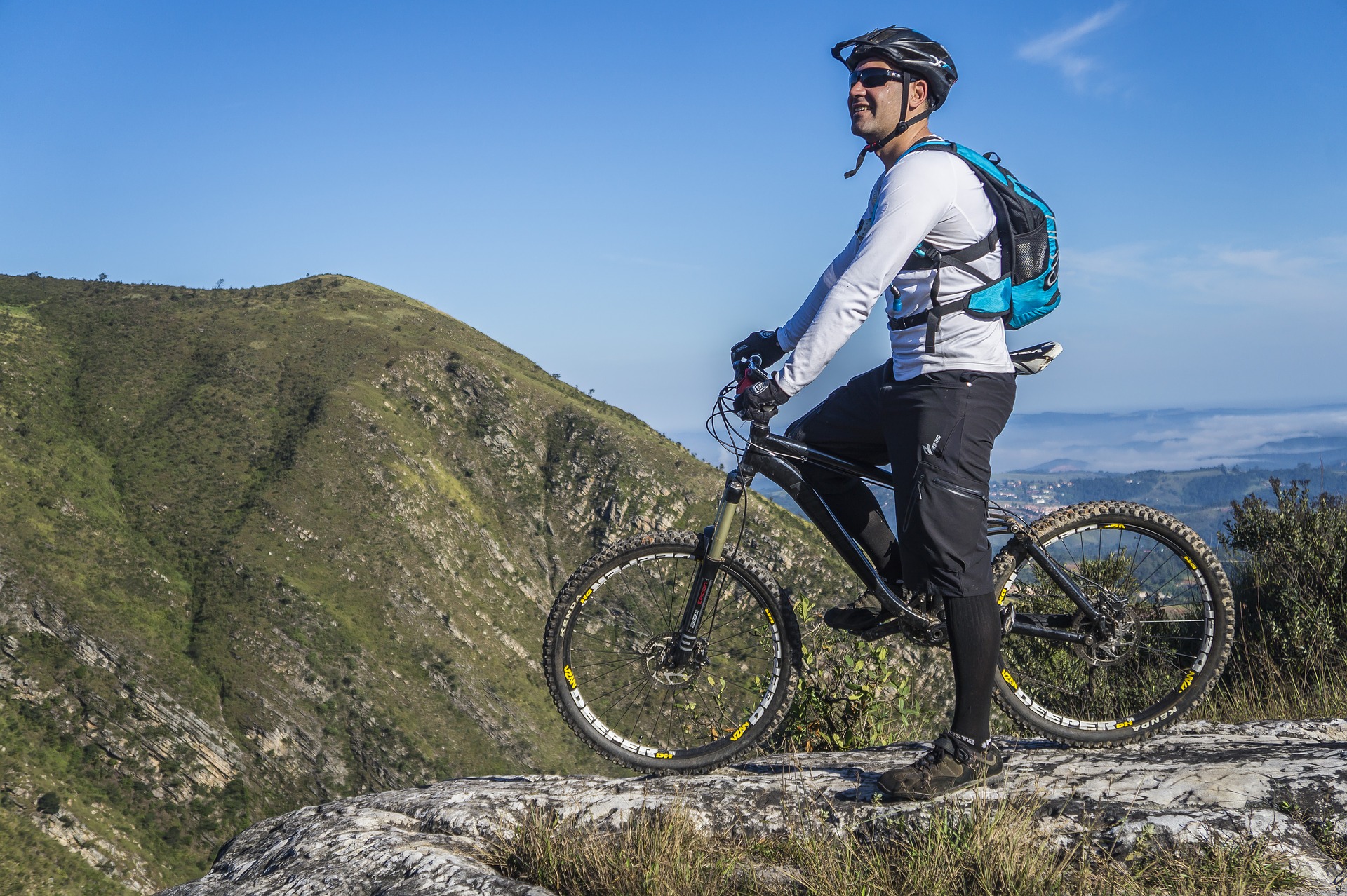 person on a mountain bike with a helmet on
