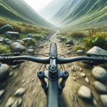pov image of a mountain biker going down a rocky trail happy to be wearing mtb elbow pads